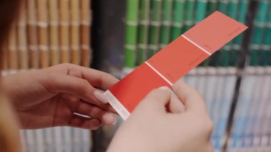 Designer shows color palette of samples closeup. High quality FullHD footage