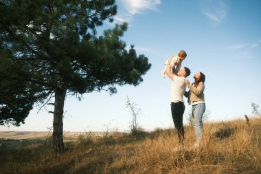 Shared joyful moments of a loving family spending quality time together outside amidst the beauty of nature