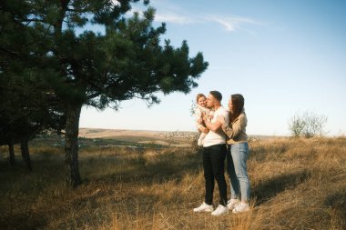 A heartwarming family scene in nature, showcasing love and deep connection amidst stunning landscapes