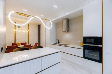 This contemporary kitchen design showcases sleek cabinetry combined with modern fixtures for a stylish look