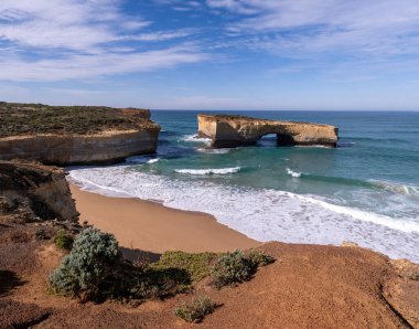 London Bridge Australia on the Great Ocean Road on a Sunny Morning clipart