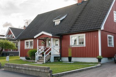 Sweden, Knislinge  July 7, 2022: Traditional old vintage red Swedish house from wood on a sunny day in summer. Stylish European private house.