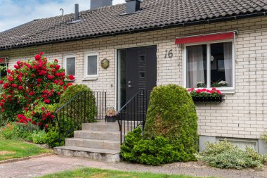 Sweden, Knislinge  July 7, 2022: Beautiful decorated facade of a typical private house in Europe. Architecture, stylish house. Concept of a building. Summer house.