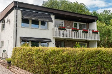Sweden, Knislinge  July 7, 2022: Beautiful decorated facade of a typical private residential house in Europe. Architecture, stylish house. Concept of a building. Summer house.
