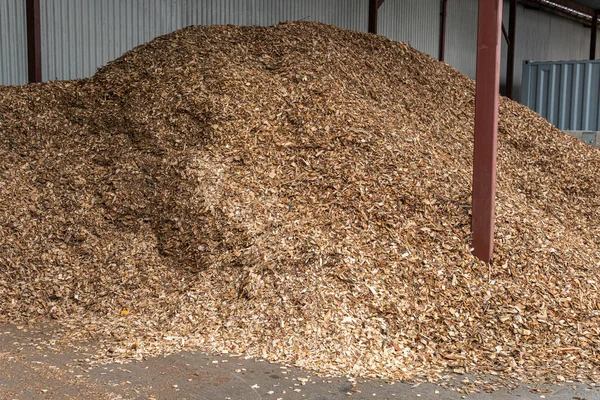 stock image Sawdust pile, bunch of wood pieces, chips outdoors in a warehouse