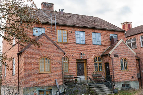 Old ancient vintage house from red bricks in gothic style. Residential building, real estate.