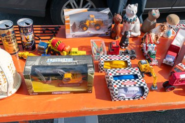 Sweden, Broby  May 27, 2023: A lot of different Brios and other collectible toy cars and toys at flea market, garage sale. Second hand, used toys.  clipart