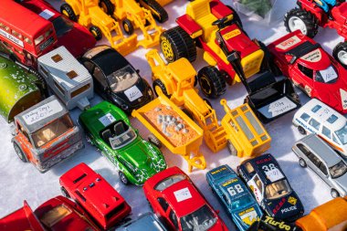 Sweden, Broby  May 27, 2023: A lot of different Brios and other collectible toy cars and toys at flea market, garage sale. Second hand, used toys.  clipart