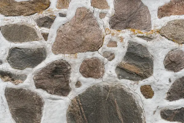 stock image Texture of big stones and concrete, old wall stone. Typical fence from stones in Scandinavian countries.