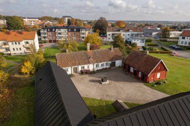 View of a small European town from a drone. Many private and residential houses. A cozy place to live with developed infrastructure. clipart