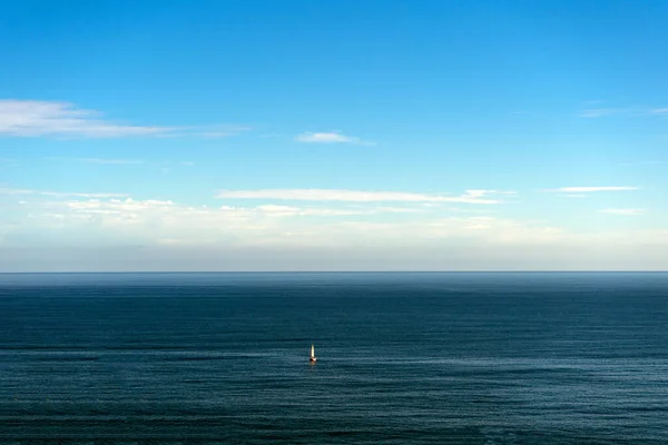 lonely sailing boat in ocean, seascape. Spain, Basque Country