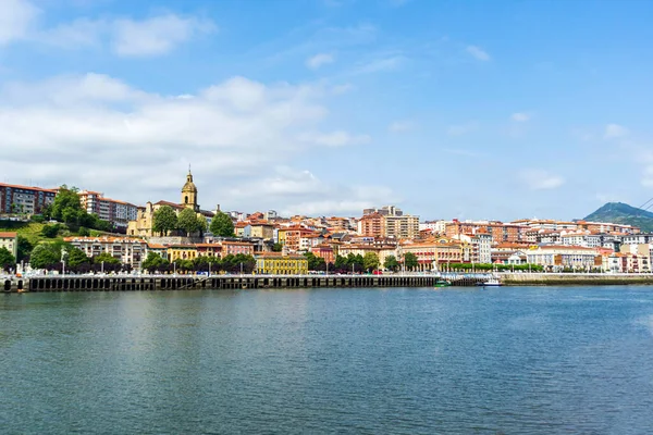 stock image View of Portugalete town by Nervion river, and Sandra Maria basilica, Basque Country, Spain