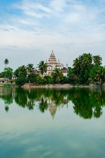 stock image Shiva Temple view from Shyam Sarobar lake, at Puthia Rajbari complex view from the pond, in Puthia, Bangladesh. Pancha Ratna Shiva Temple