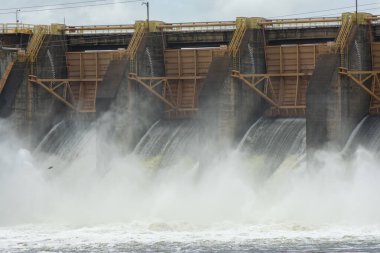 Close up of Barra Bonita dam with open hydroelectric plant gates. The Barra Bonita Lock is used for vessels to cross the gaps between the upper and lower levels of the dam.