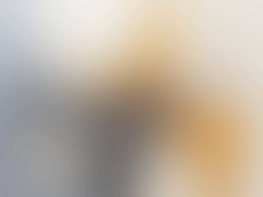 abstract pastel soft colorful smooth blurred textured background off focus toned in gold color