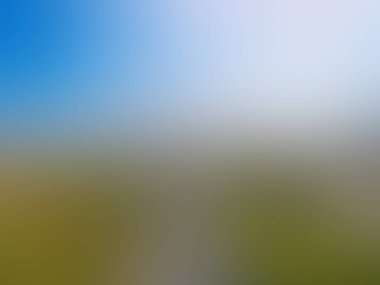 Mavi gökyüzü olan bir alanın bulanık arkaplanı