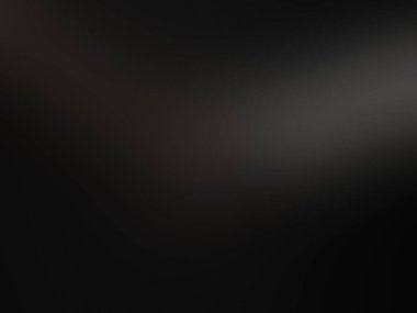 Elinde mikrofon tutan takım elbiseli ve kravatlı bir adam.