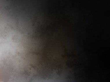 Elinde cep telefonu olan takım elbiseli ve kravatlı bir adam.