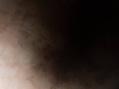 Elinde cep telefonu olan takım elbiseli ve kravatlı bir adam.