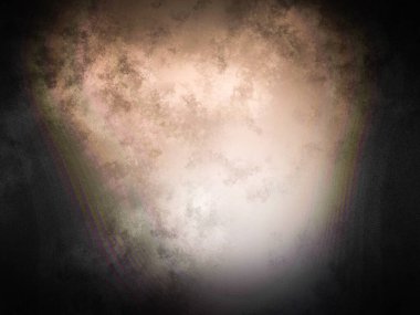 Elinde cep telefonu olan takım elbiseli ve kravatlı bir adam.