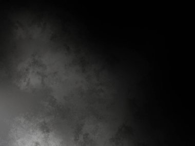 Siyah gömlekli bir adam kaykay tutuyor.