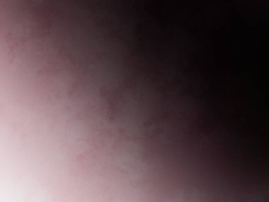 Pembe arka planda duran takım elbiseli ve kravatlı bir adam.