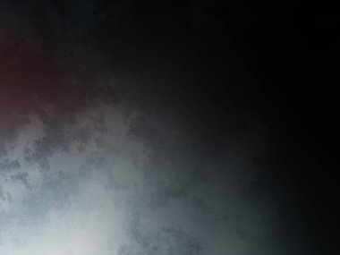 Bir binanın üstündeki karanlık gökyüzünde kırmızı bir ışık.