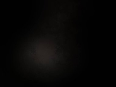 Ortasında ışık olan siyah bir arkaplan