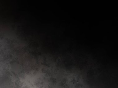 Siyah bir arka planın önünde duran takım elbiseli ve kravatlı bir adam.