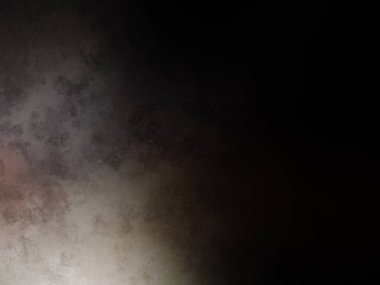 Elinde cep telefonu olan takım elbiseli ve kravatlı bir adam.