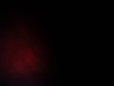 Karanlık bir odada parlayan kırmızı bir ışık.