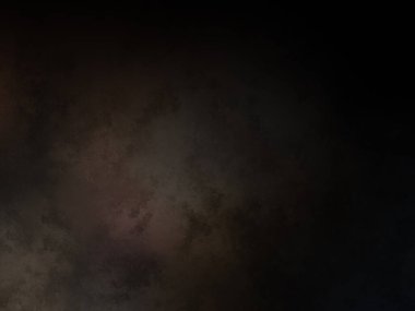 Elinde cep telefonu olan takım elbiseli ve kravatlı bir adam.