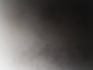 Dizüstü bilgisayarla yatakta oturan biri.