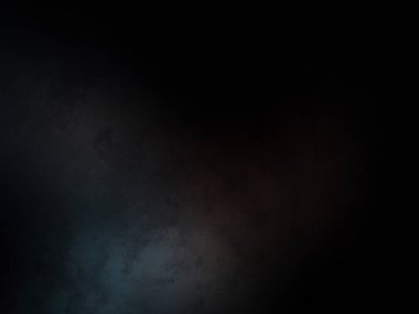 Siyah bir arka planın önünde duran takım elbiseli ve kravatlı bir adam.