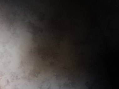 Elinde cep telefonu olan takım elbiseli ve kravatlı bir adam.