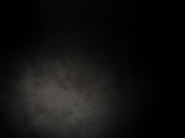 Ortada siyah bir nokta olan siyah bir arkaplan.