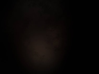 Ortasında ışık olan siyah bir arkaplan