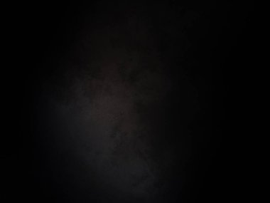 Ortasında beyaz ışık olan siyah bir arkaplan.