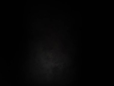 Ortasında beyaz ışık olan siyah bir arkaplan.