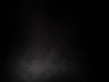 Karanlıkta parlayan bir ışıkla siyah bir arkaplan.