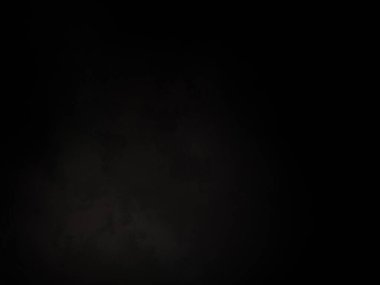 Ortasında beyaz ışık olan siyah bir arkaplan.