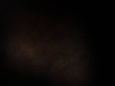 Siyah bir arka planın önünde duran takım elbiseli ve kravatlı bir adam.