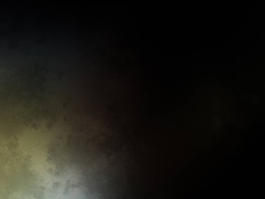 Siyah bir arka planın önünde duran takım elbiseli ve kravatlı bir adam.