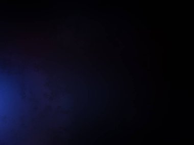 Elinde mikrofon tutan takım elbiseli ve kravatlı bir adam.