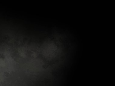 Siyah bir arka planın önünde duran takım elbiseli ve kravatlı bir adam.