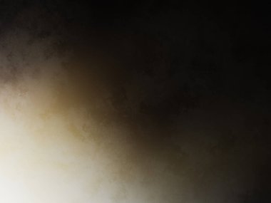 Elinde cep telefonu olan takım elbiseli ve kravatlı bir adam.