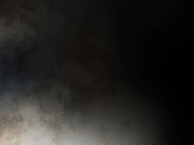 Siyah bir arka planın önünde duran takım elbiseli ve kravatlı bir adam.