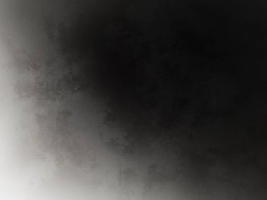 Takım elbiseli bir adamın siyah beyaz fotoğrafı.