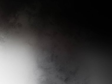 Takım elbiseli ve kravatlı bir adam duvarın önünde duruyor.