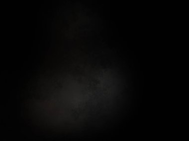 Ortasında beyaz ışık olan siyah bir arkaplan.